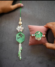 Resin pestal green rakhi pair set