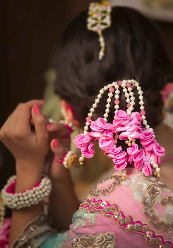 Pink Handcrafted floral haldi bridal Bun Accessories jewellery in pearls with tassels