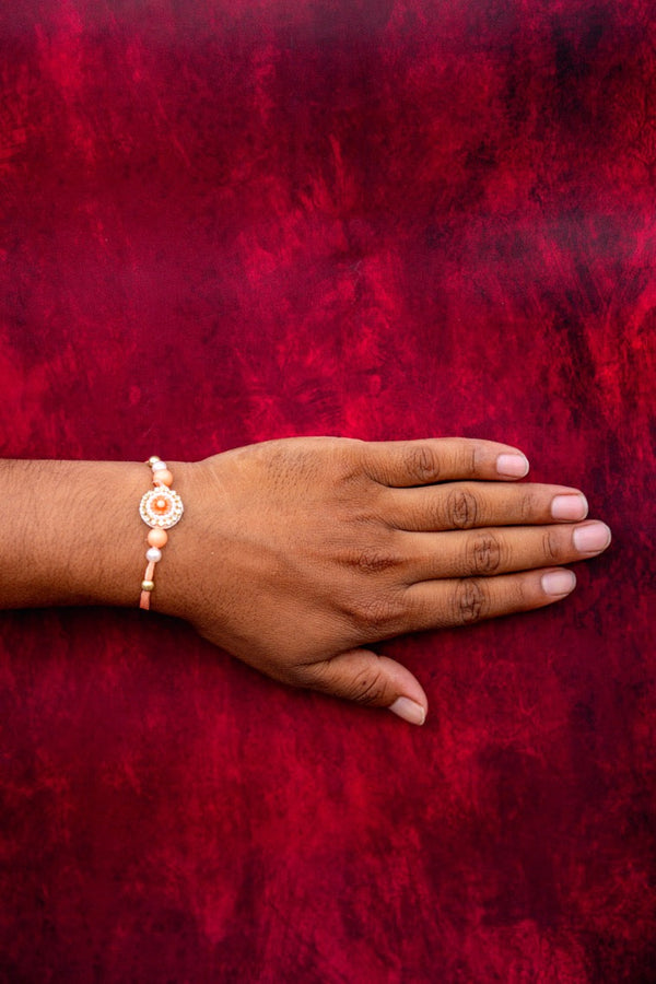 Orange white moti bhai rakhi