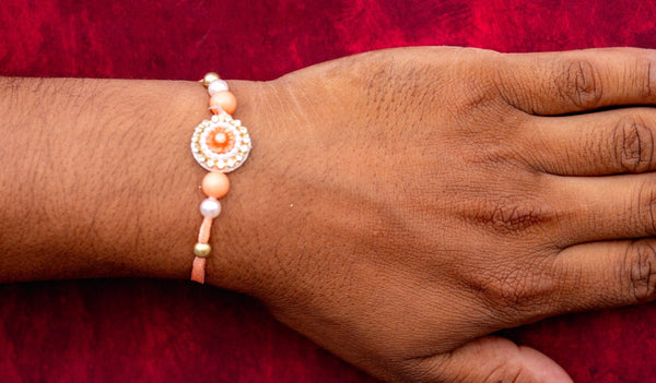 Orange white moti bhai rakhi